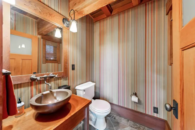 a bathroom with a toilet a sink and a shower