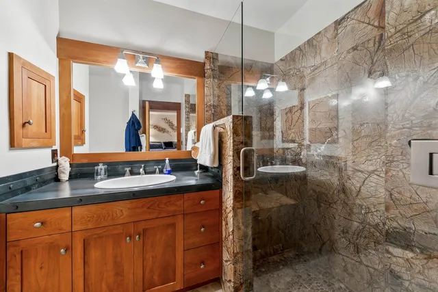 a bathroom with a sink and a mirror