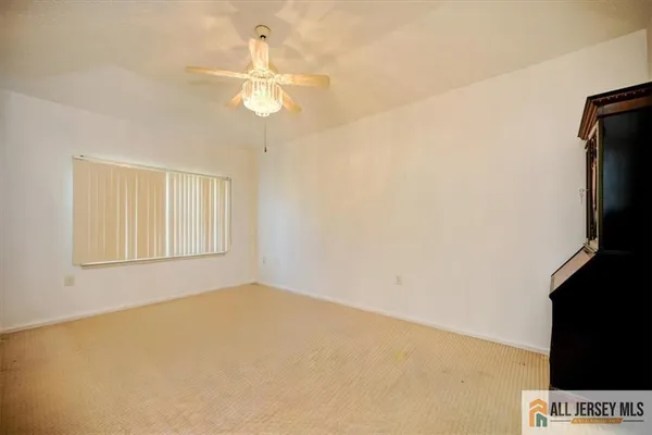 wooden floor in an empty room and a bathroom