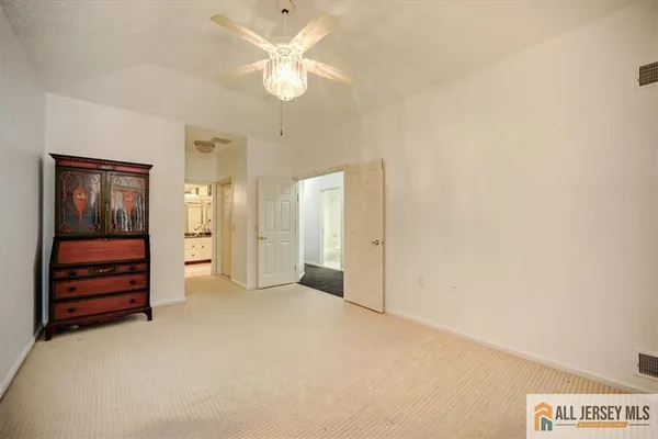 a spacious bathroom with a tub sink and shower