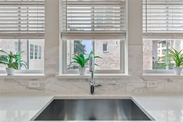 a kitchen with a sink and a window