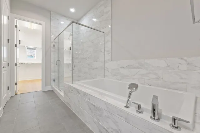 an empty room with closet and a bathroom