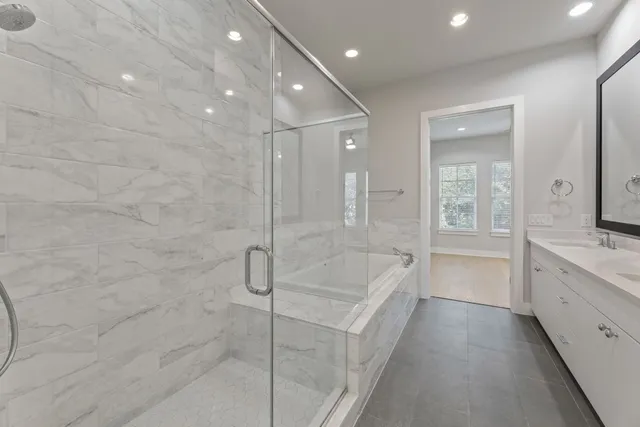 a bathroom with a bathtub and a sink
