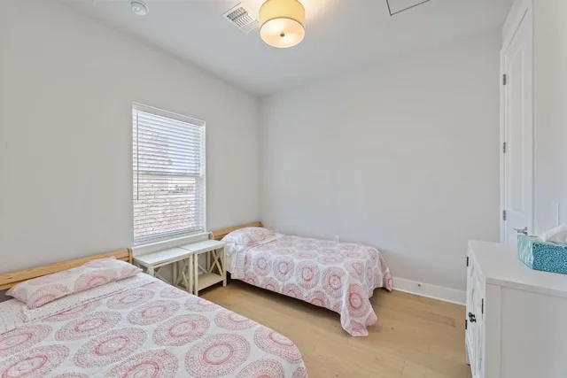 a spacious bathroom with a granite countertop sink a mirror and a bathtub
