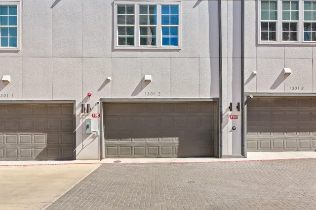 a view of a balcony with a table and chairs