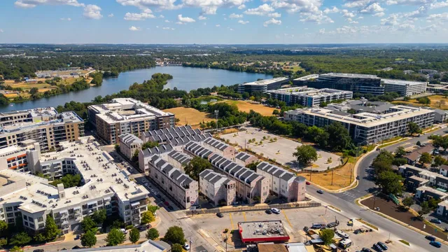 an aerial view of a houses with outdoor space
