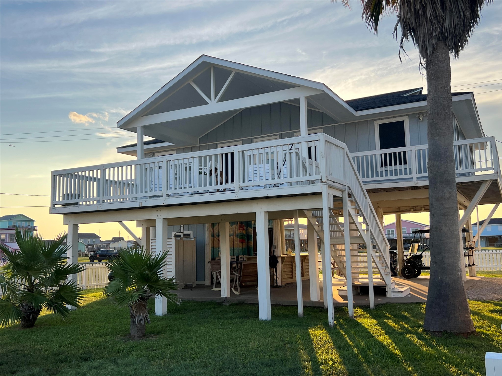 307 Angel Wing Street Surfside Beach, TX 77541 - Photo 23 of 23 a front view of a house with a yard table and chairs