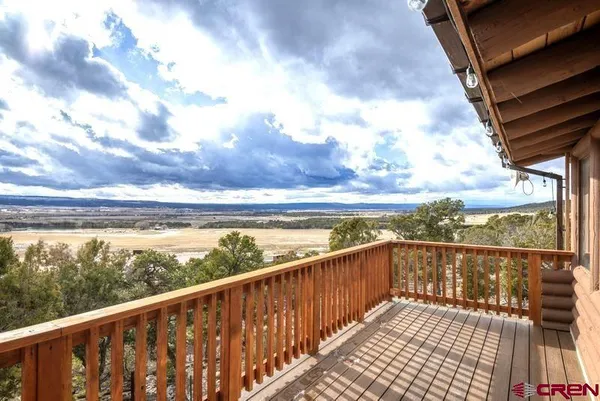 a view of a two chairs in balcony