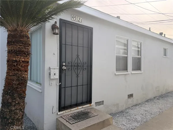 a view of a door and wooden house