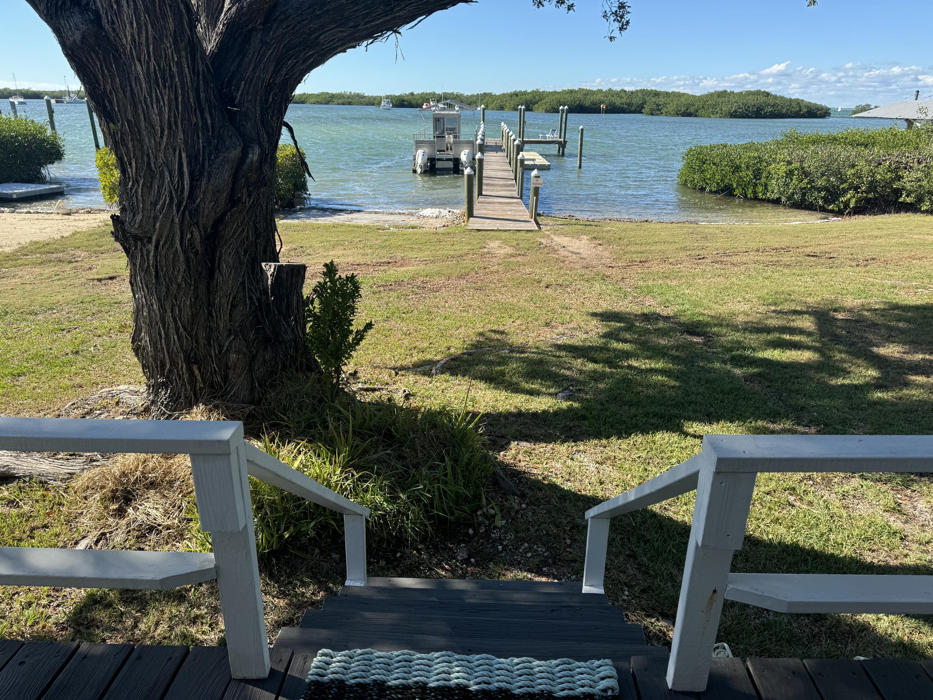 184 Harborview Drive Tavernier, FL 33070 - Photo 1 of 23 swimming pool with lawn chairs