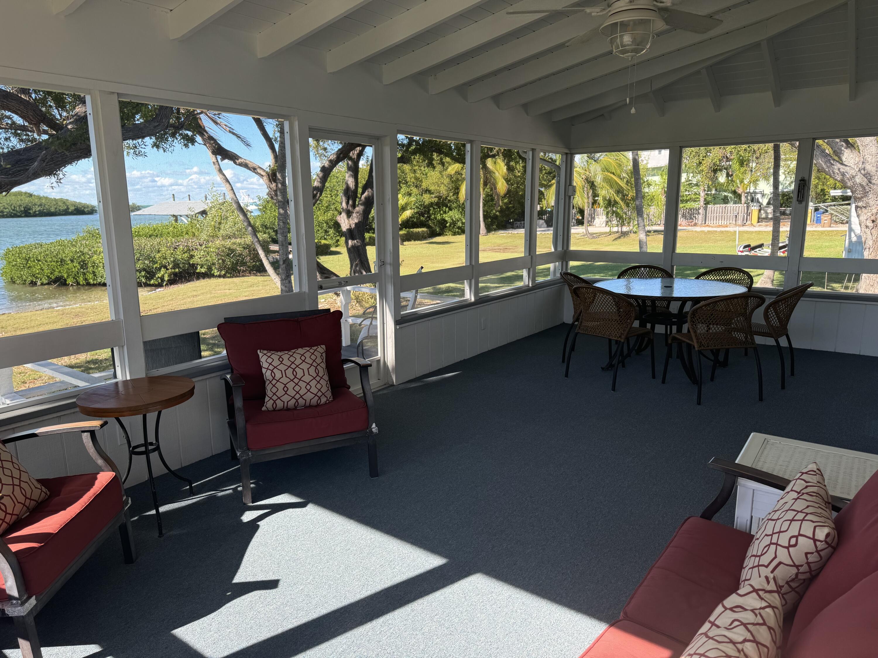 184 Harborview Drive Tavernier, FL 33070 - Photo 11 of 23 a living room with furniture and a large window