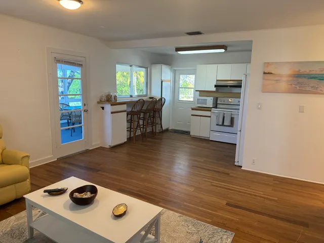 a living room with furniture and a rug