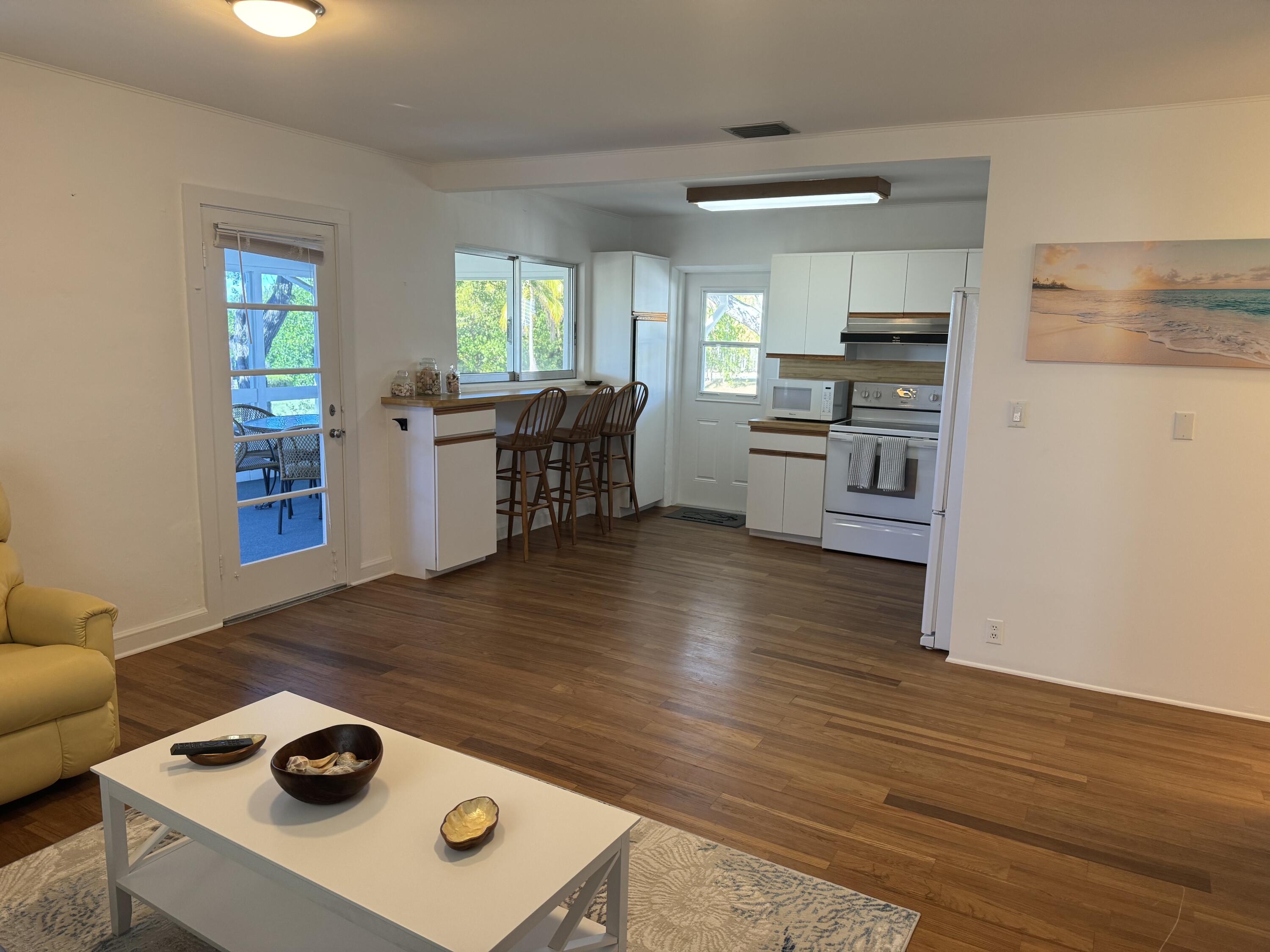 184 Harborview Drive Tavernier, FL 33070 - Photo 16 of 23 a kitchen with a stove and a refrigerator