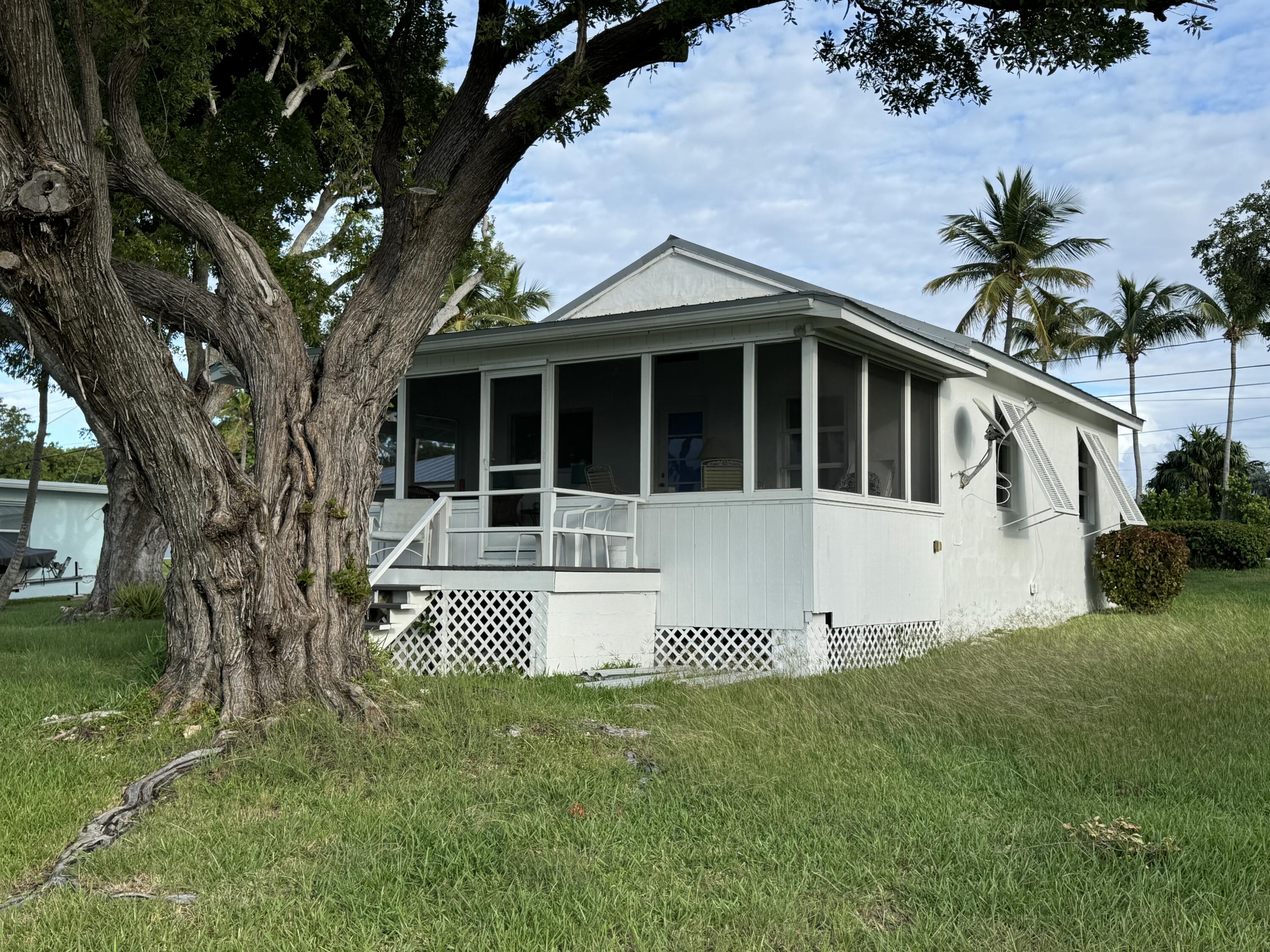 184 Harborview Drive Tavernier, FL 33070 - Photo 7 of 23 a house view with a garden space