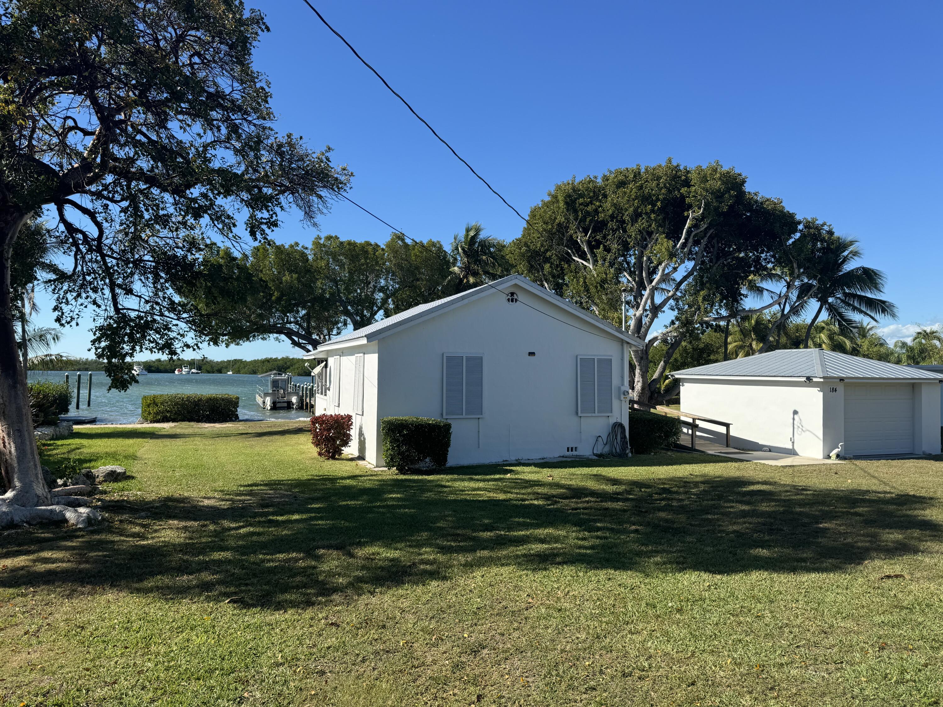 184 Harborview Drive Tavernier, FL 33070 - Photo 8 of 23 a view of a back yard of the house
