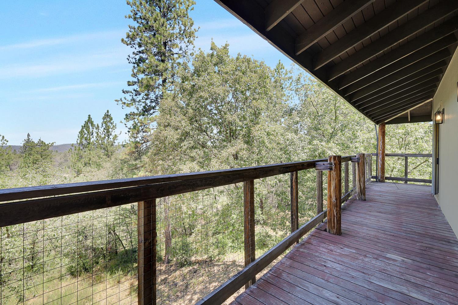 9490 Ranger Trail Oregon House, CA 95962 - Photo 32 of 90 Covered deck and walk way to upstairs storage/work room.