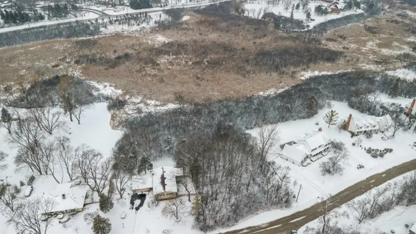 a view of snow on the road