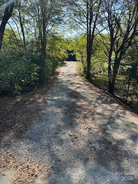 1424 Jj Autry Road Marshville, NC 28103 - Photo 12 of 12 a view of a dirt road with trees in the background