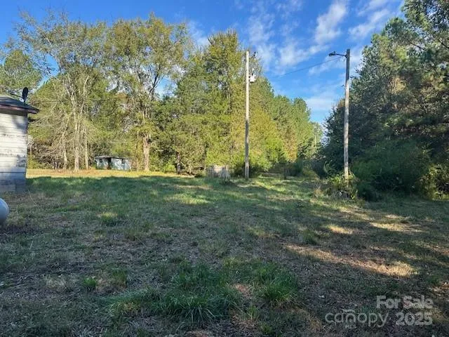 a view of outdoor space with trees all around