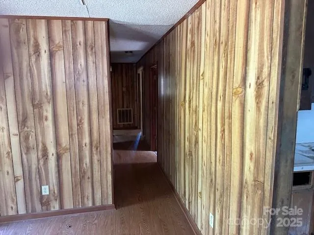a view of a kitchen with a sink and cabinets