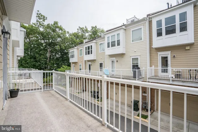 a bedroom with a bed and a lamp