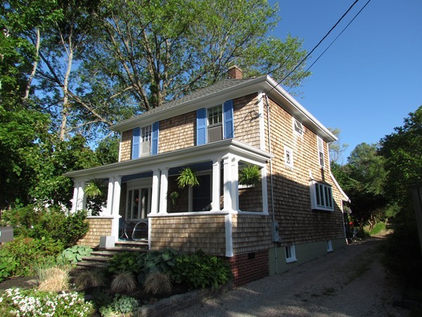 99 First Parish Road Scituate, MA 02066 - Photo 2 of 30 a front view of a house with a garden