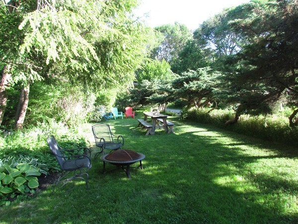 99 First Parish Road Scituate, MA 02066 - Photo 8 of 30 a view of a table and chairs in the green field
