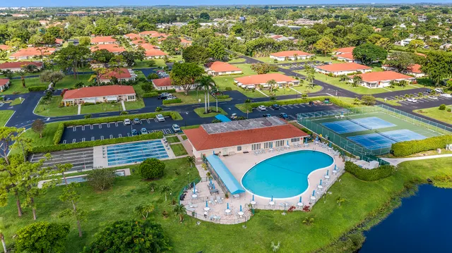 an aerial view of residential house with outdoor space and pool