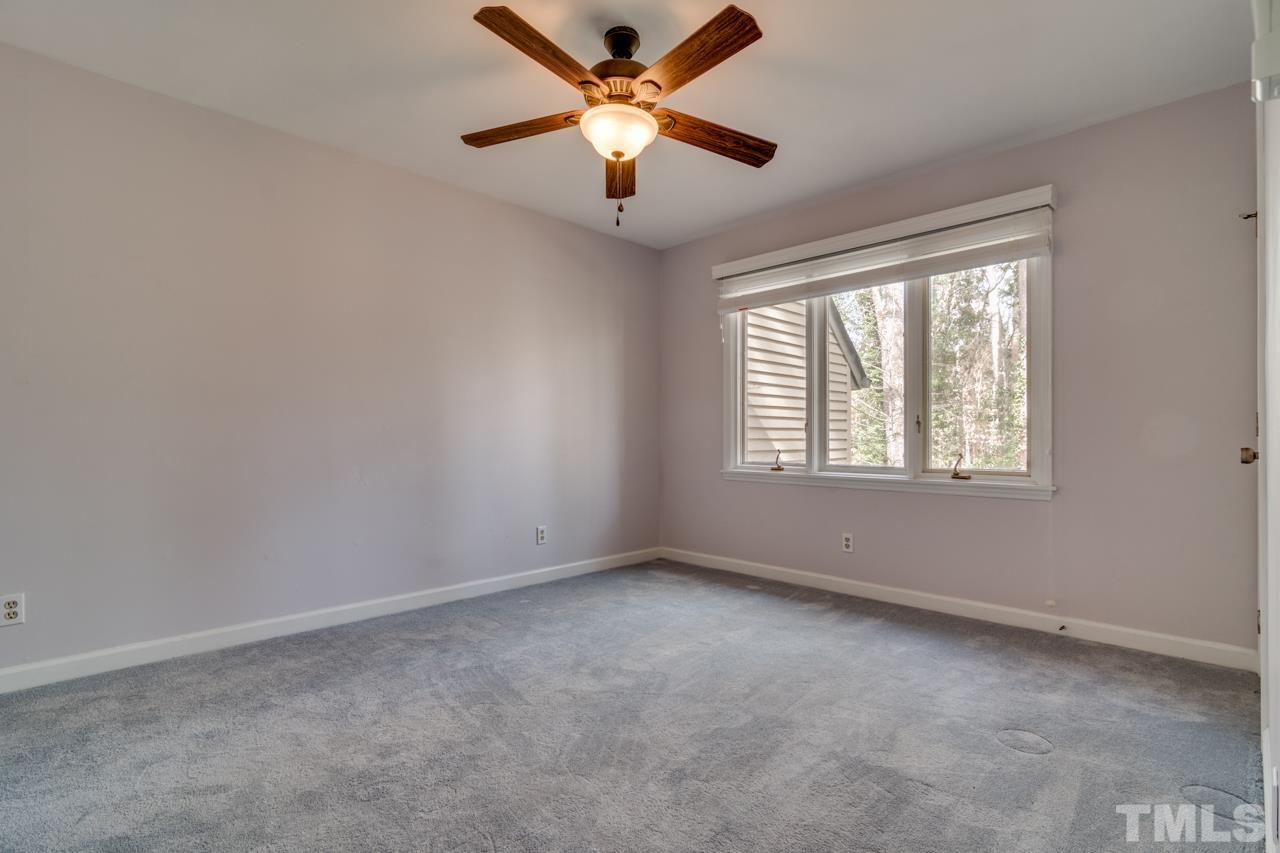 22 Glenmore Drive Durham, NC 27707 - Photo 18 of 27 a view of an empty room with a window