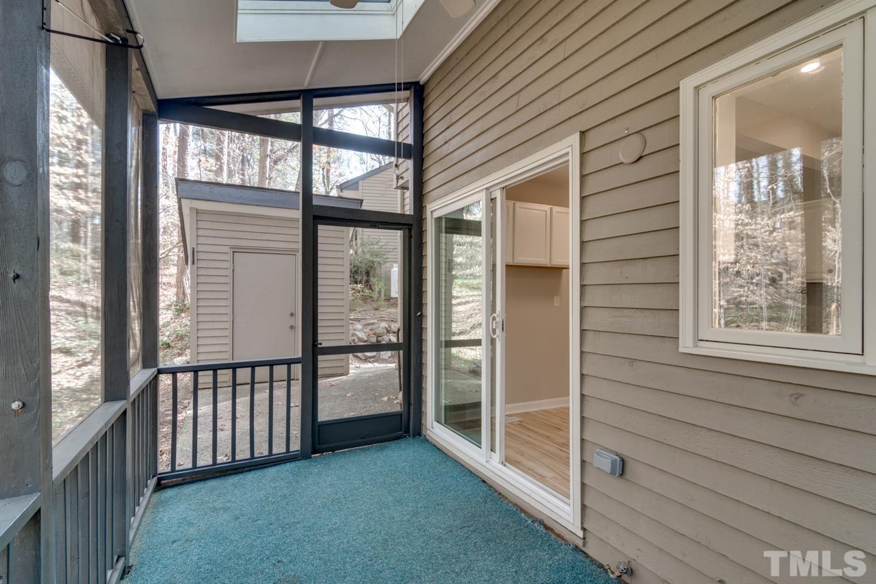 22 Glenmore Drive Durham, NC 27707 - Photo 21 of 27 a view of a porch with a table and chairs