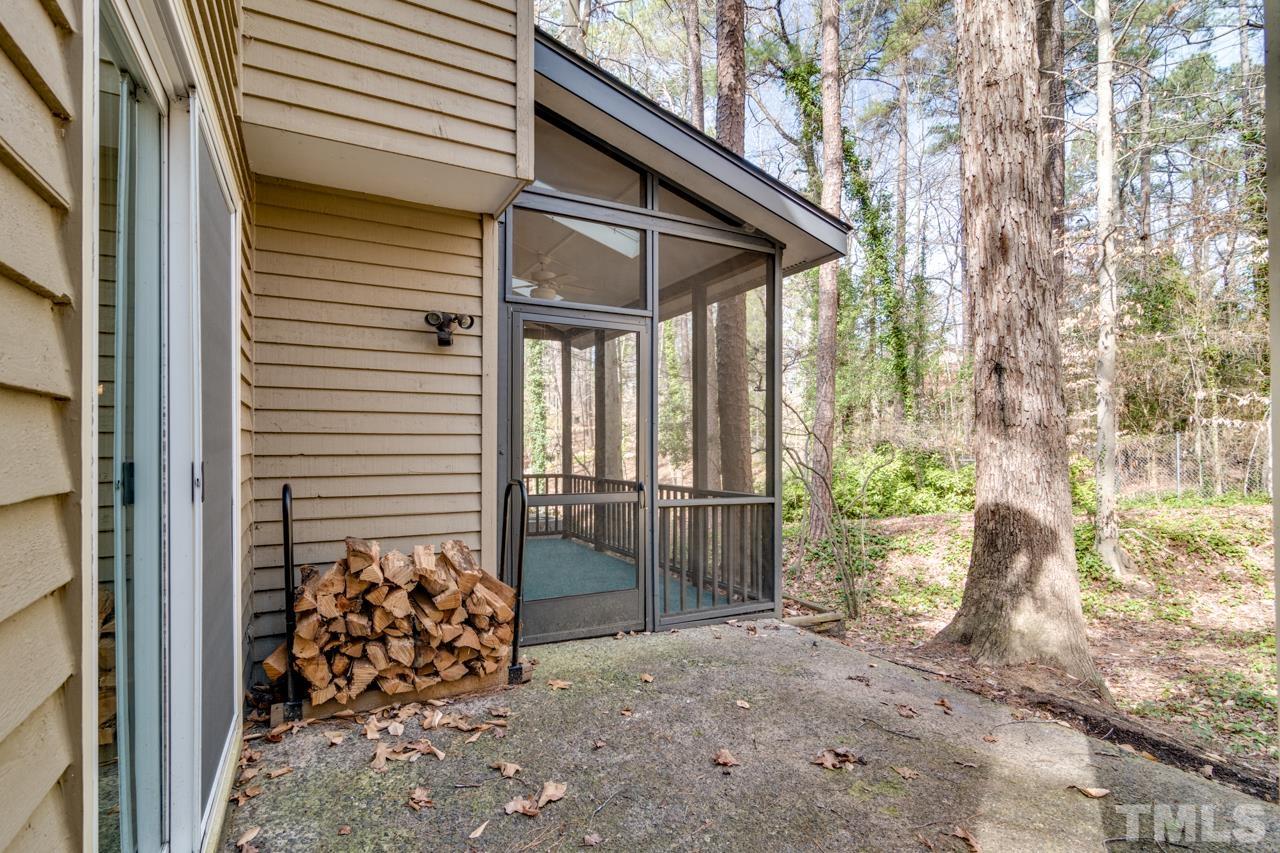22 Glenmore Drive Durham, NC 27707 - Photo 23 of 27 a view of a porch with furniture and floor to ceiling window
