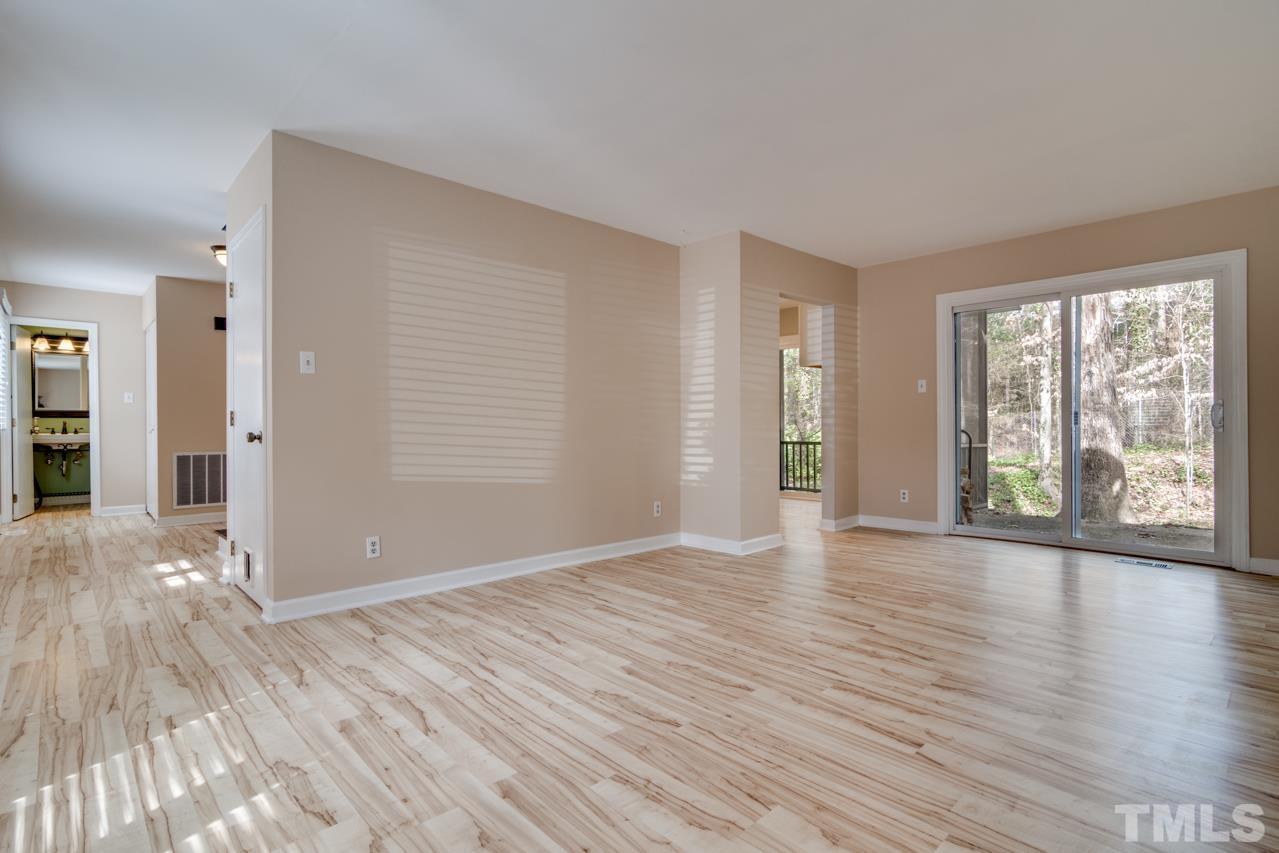 22 Glenmore Drive Durham, NC 27707 - Photo 6 of 27 a view of an empty room with wooden floor and a window