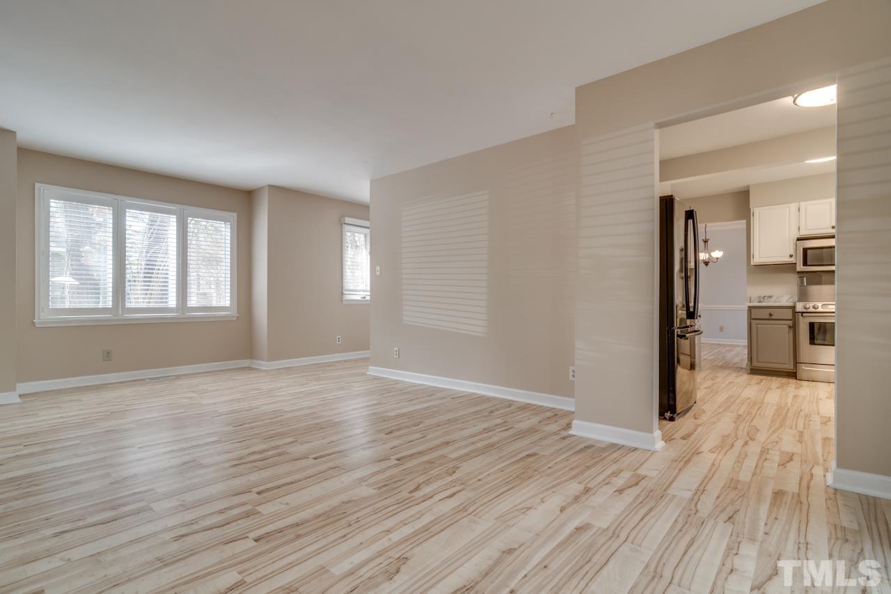 22 Glenmore Drive Durham, NC 27707 - Photo 7 of 27 wooden floor in an empty room with a window