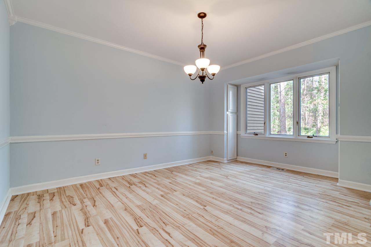 22 Glenmore Drive Durham, NC 27707 - Photo 9 of 27 wooden floor in an empty room with a window