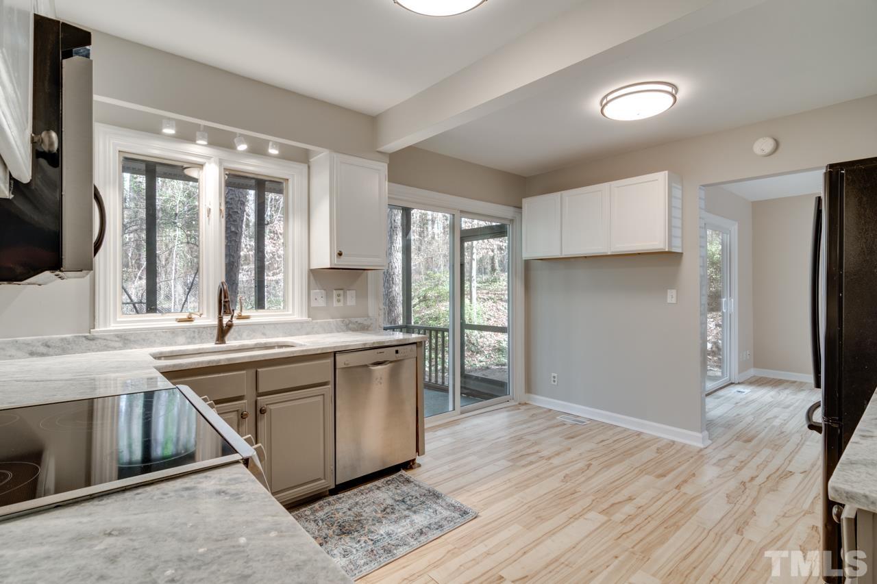 22 Glenmore Drive Durham, NC 27707 - Photo 10 of 27 a kitchen with stainless steel appliances granite countertop a refrigerator and a sink