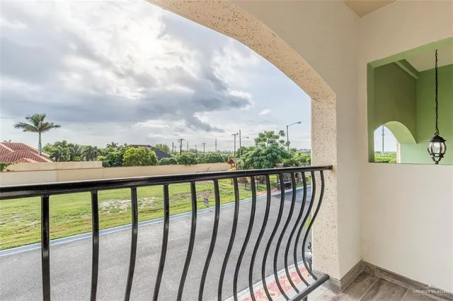 a view of balcony with furniture