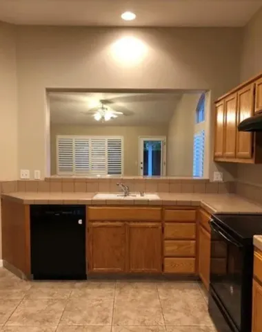 a kitchen with a sink and a stove