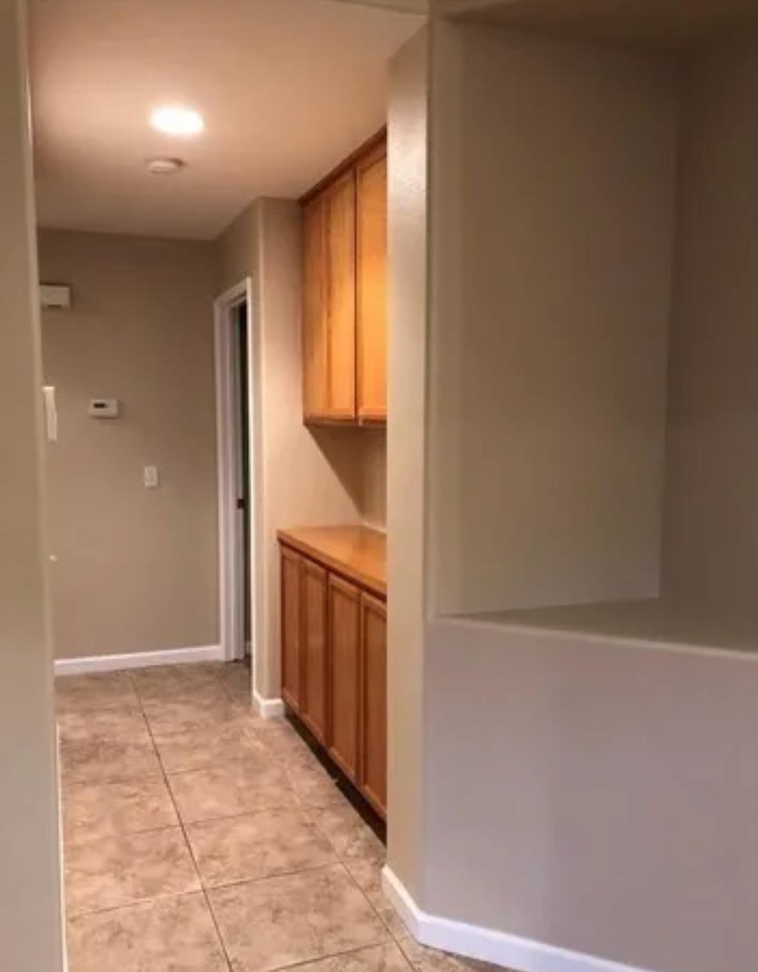 1787 Edgewood Court Merced, CA 95340 - Photo 6 of 9 a view of hallway with cabinets