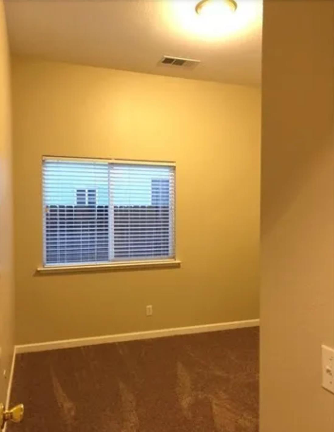 1787 Edgewood Court Merced, CA 95340 - Photo 7 of 9 a view of a blue wall with vinyl laminate floor