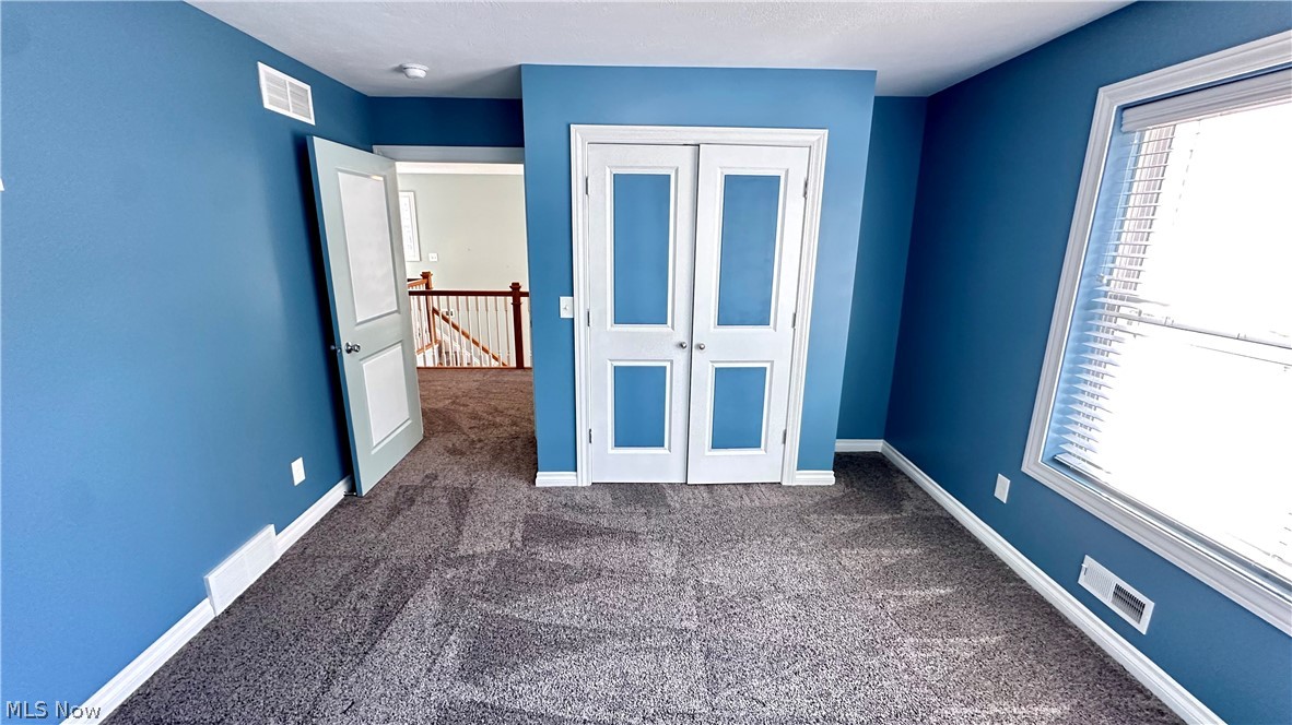 2603 Rockefeller Road Wickliffe, OH 44092 - Photo 16 of 34 Room featuring blue walls and gray patterned carpeting