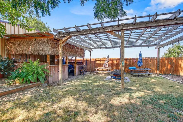 a view of a parking space with a patio