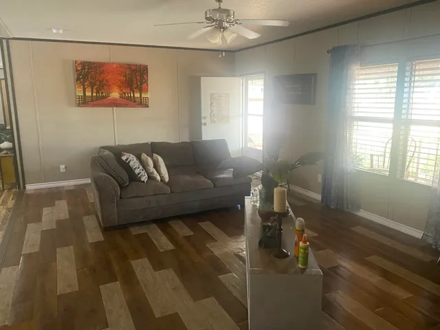 a living room with furniture and a window