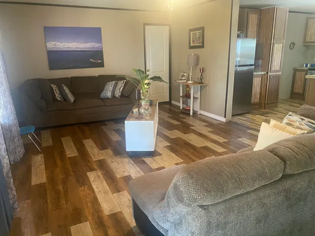 a living room with furniture and a rug