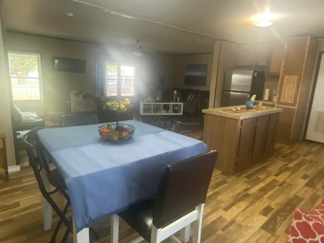 a dining room with a table and chairs