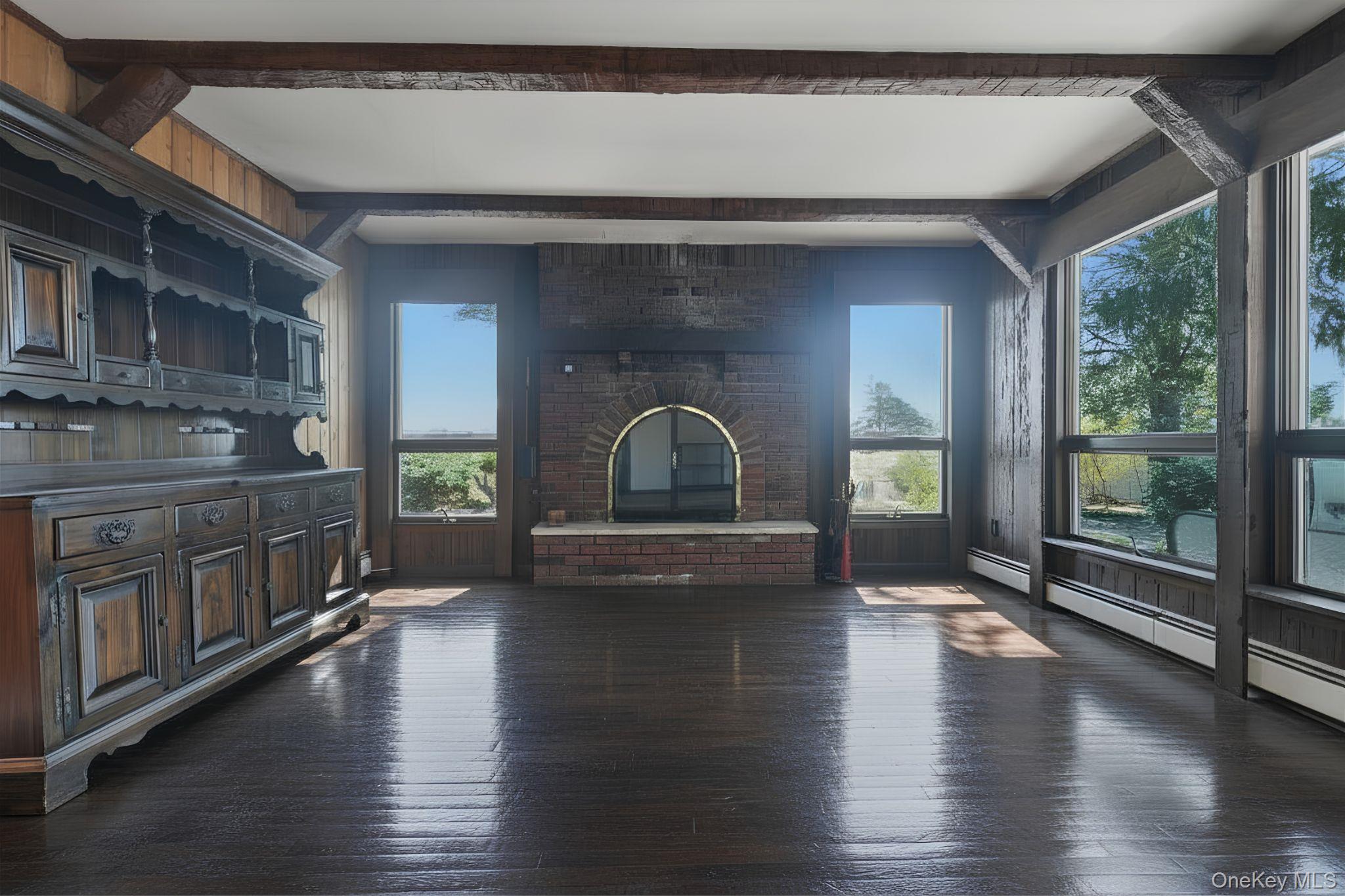 19 Gaymor Lane Commack, NY 11725 - Photo 11 of 25 a view of empty room with wooden floor and fan
