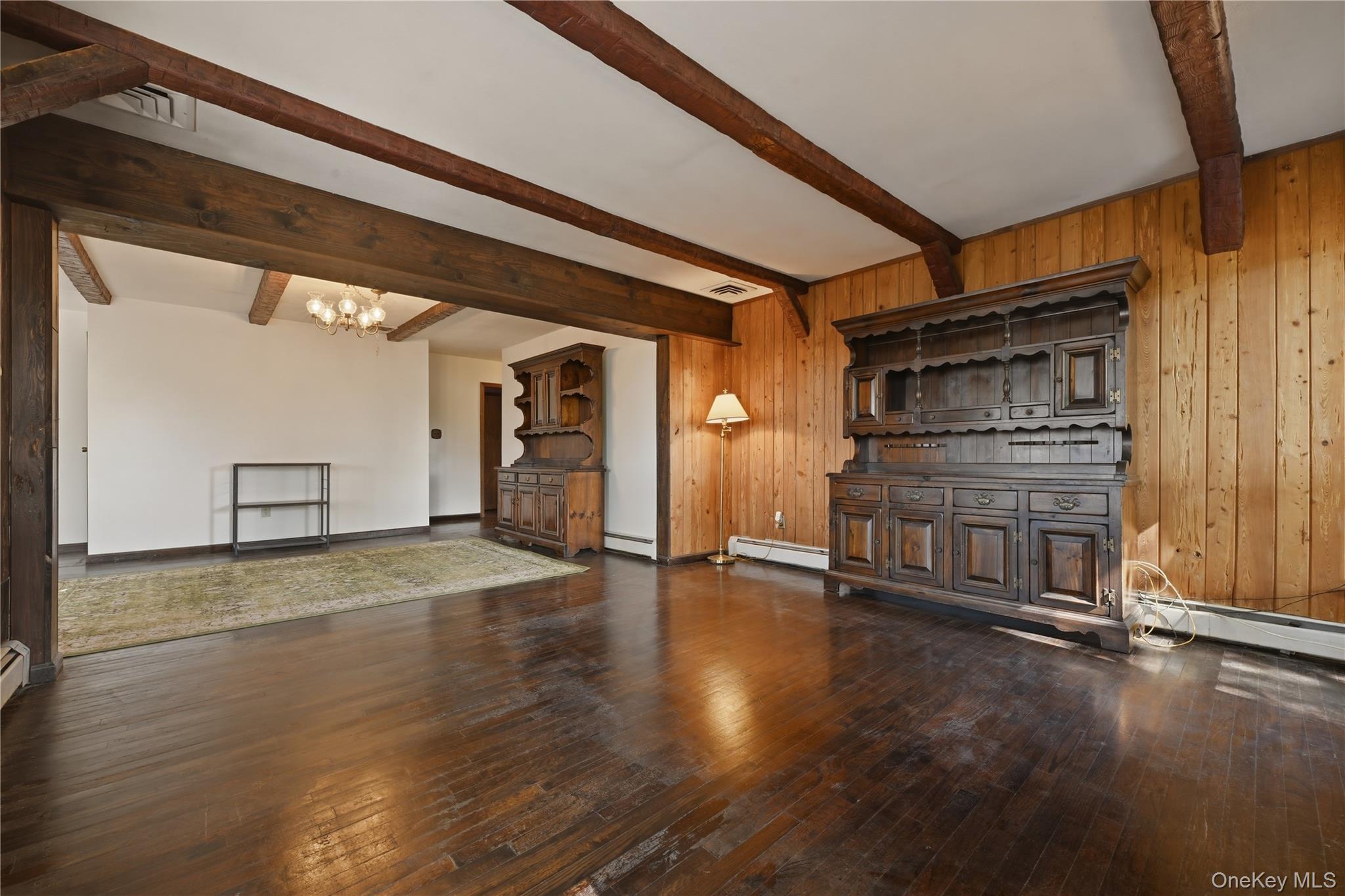 19 Gaymor Lane Commack, NY 11725 - Photo 12 of 25 a view of an empty room with wooden floor and a window