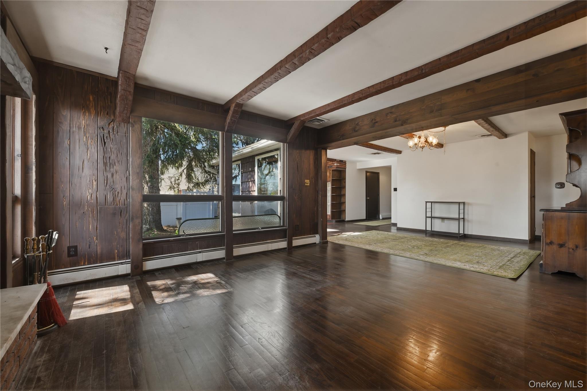 19 Gaymor Lane Commack, NY 11725 - Photo 13 of 25 a view of empty room with wooden floor and fan