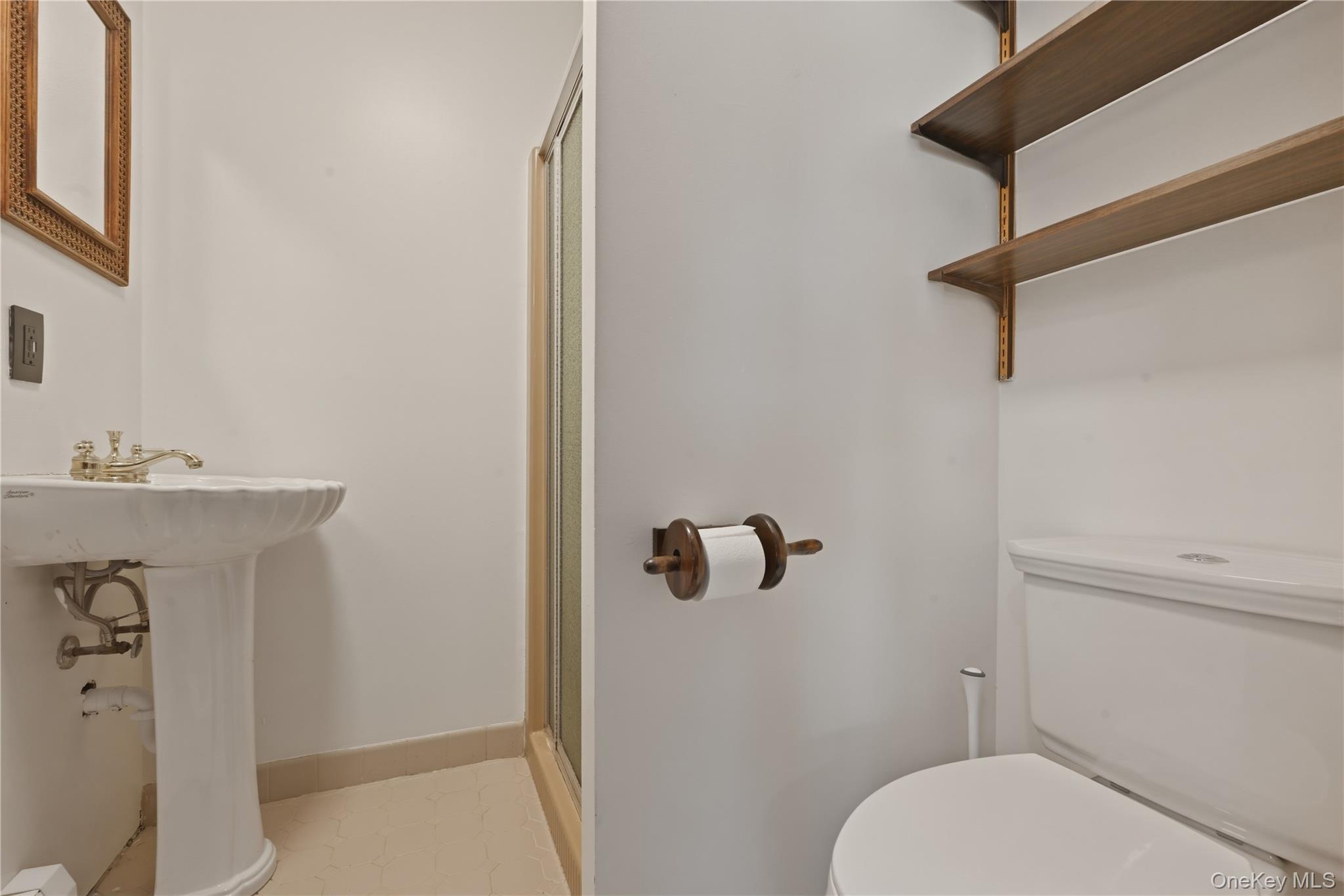 19 Gaymor Lane Commack, NY 11725 - Photo 15 of 25 a bathroom with a sink a toilet and shower