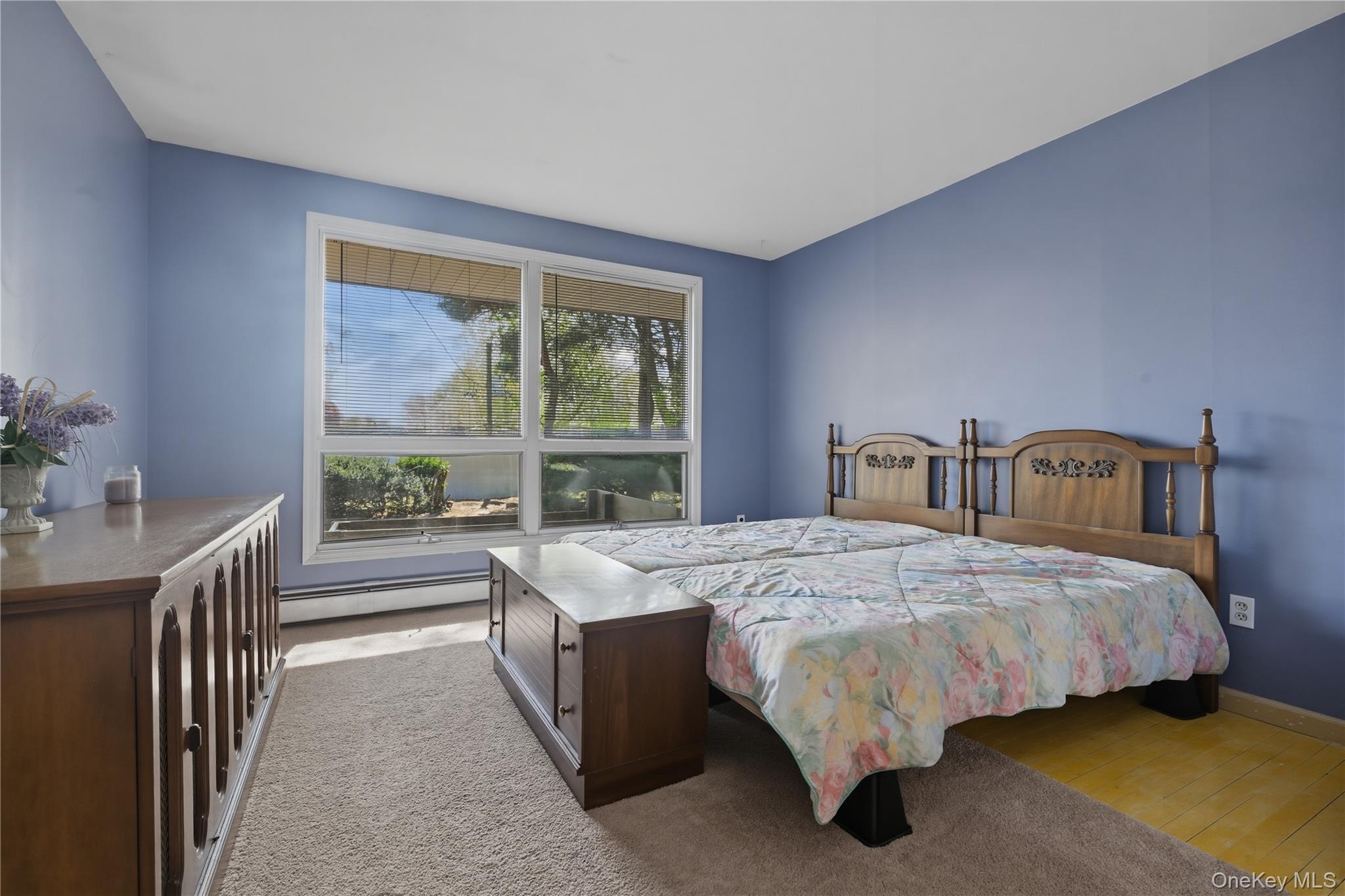 19 Gaymor Lane Commack, NY 11725 - Photo 17 of 25 a bedroom with a bed and window