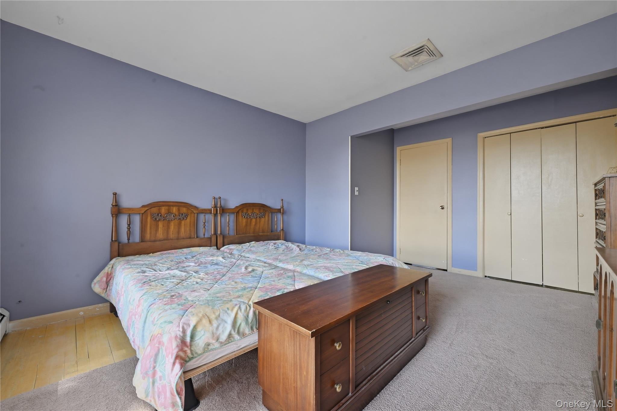 19 Gaymor Lane Commack, NY 11725 - Photo 18 of 25 a bedroom with a bed and a table